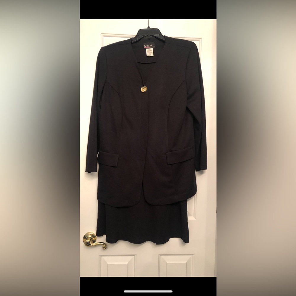 A Melissa Harper 2 pc black skirt suit. Size 16WP.